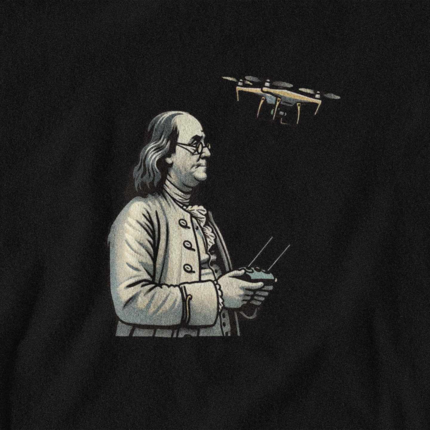 Black t-shirt with a graphic of Benjamin Franklin flying a drone