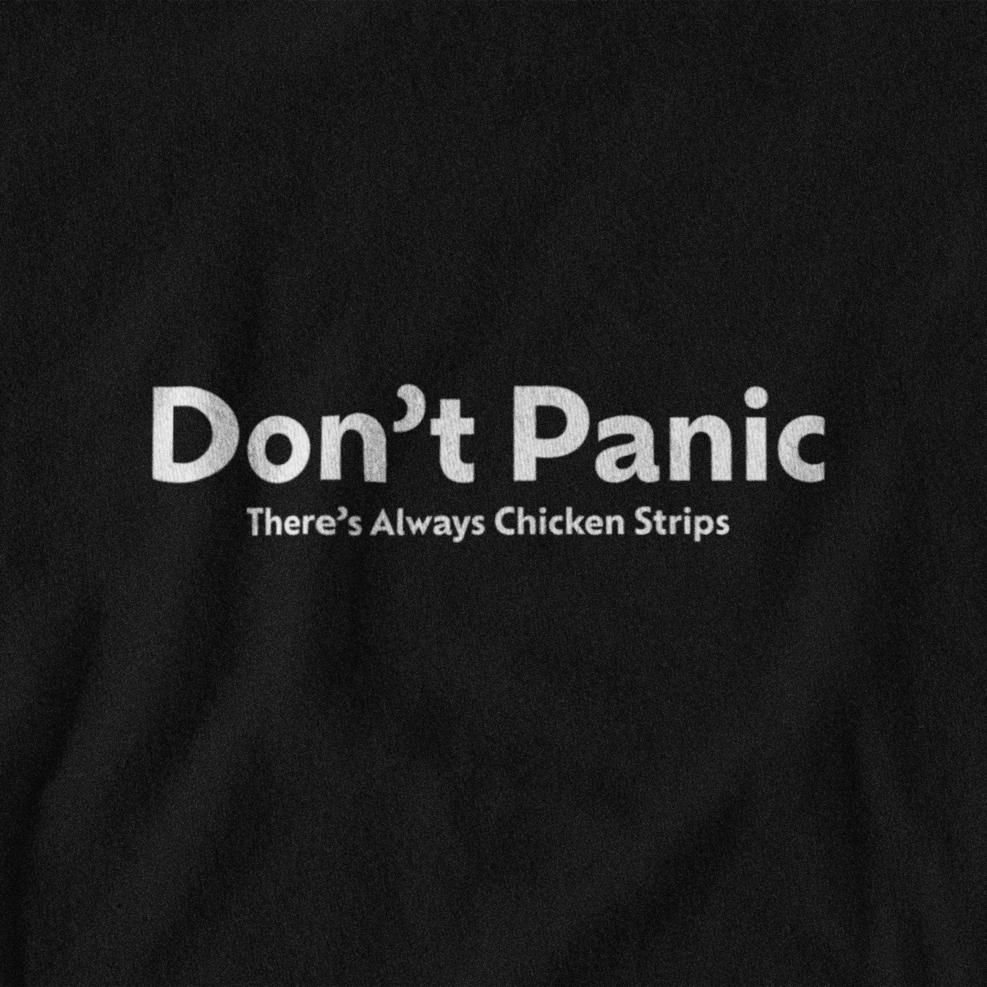 Black t-shirt with white lettering that says "Don't panic, there's always chicken strips"