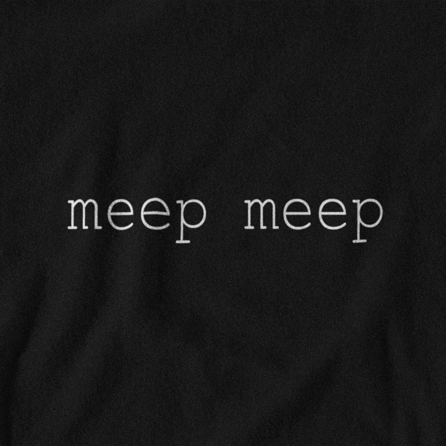 Black shirt with 'meep meep' text in white on a plain background