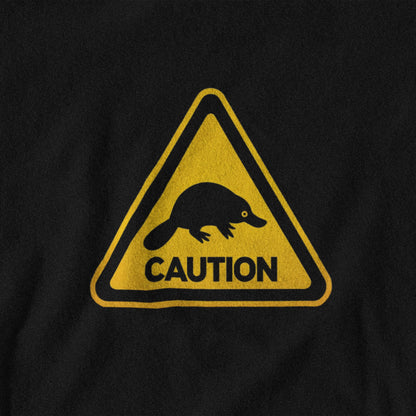Black t-shirt with a yellow and black warning sign featuring a platypus and 'CAUTION' text.