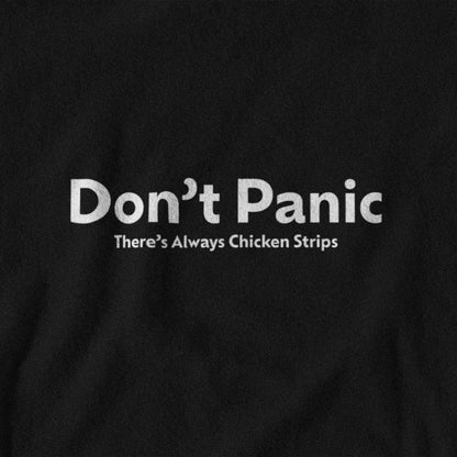 Black t-shirt with white lettering that says "Don't panic, there's always chicken strips"