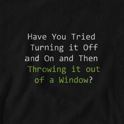 Black t-shirt with humorous text design on a plain background