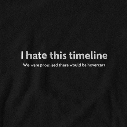 Black t-shirt with white text 'I hate this timeline. We were promised there would be hovercars.'