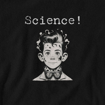 Black t-shirt with a graphic of a boy in a lab coat and goggles, text 'Science!' above, on a black background.